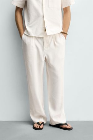 RELAXED FIT PLEATED PANTS