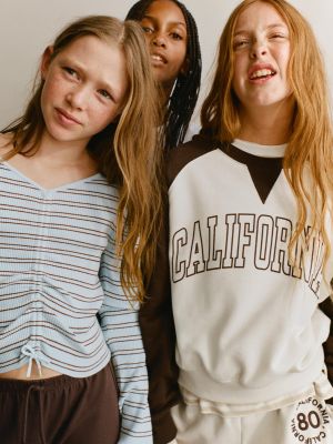 RAGLAN SLEEVE TEXT SWEATSHIRT