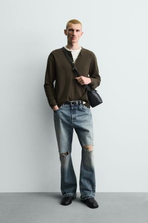 FLARE FIT RIPPED JEANS