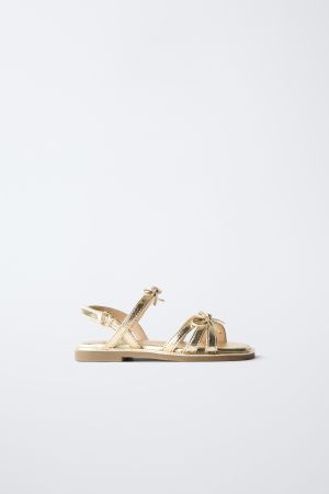 METALLIC BOW SANDALS